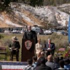 U.S. Magistrate Judge for the District of Wyoming Mark Carman speaks to new citizens after administering their naturalization oath Sept. 3 in a ceremony at Mammoth Hot Springs in Yellowstone National Park.