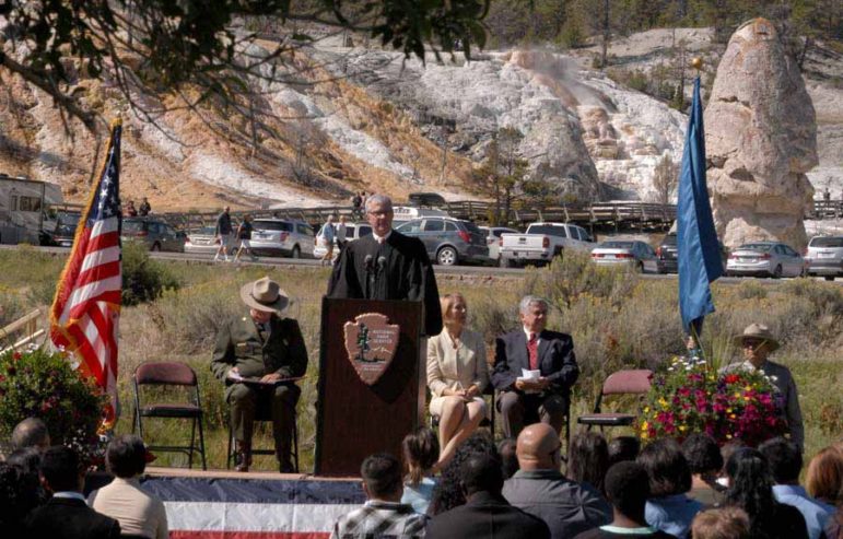 U.S. Magistrate Judge for the District of Wyoming Mark Carman speaks to new citizens after administering their naturalization oath Sept. 3 in a ceremony at Mammoth Hot Springs in Yellowstone National Park.