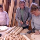 Liz Holmes, left, looks on as furniture designer John Gallis helps Hilary Heminway build a stool during a 2008 workshop as part of the Cody High Style show. Gallis coached a dozen students at his Norseman Designs West workshop on how to create a stool in the style of Western design pioneer Thomas Molesworth.