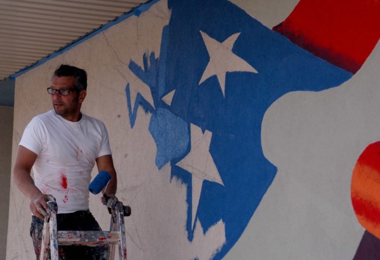 Artist Scott LaBaido is painting American flag murals on veterans' posts in all 50 states, including one in Cody, Wyo.