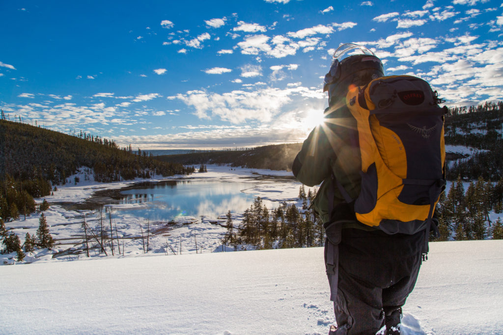 A visitor to Yellowstone National Park stops to take in the snowy view.