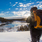 A visitor to Yellowstone National Park stops to take in the snowy view.