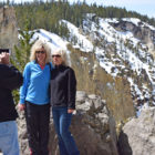 Jacob Baisley, who recently quit his job and sold his house to travel to national parks, snaps a photo May 4 of two Yellowstone National Park visitors at Artist Point.