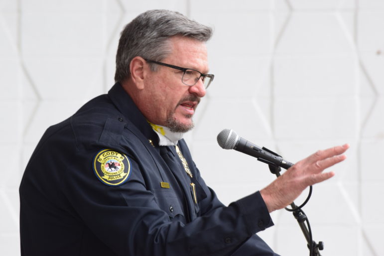 Cody Police Chief Chuck Bakers praises attendees at a peaceful rally in Cody, Wyo. on Sunday.